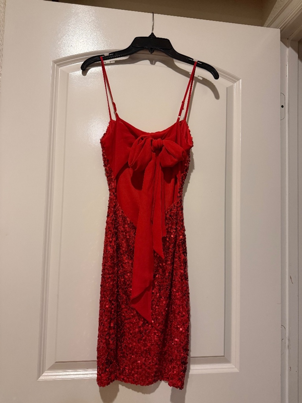 Red sequin party dress with a statement bow back. Size 0. Red.